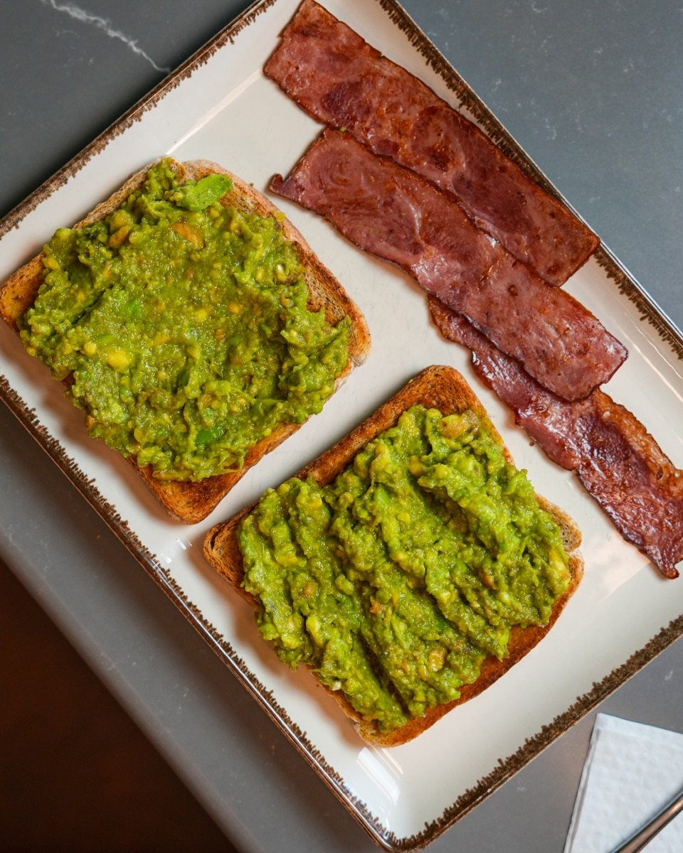 Smashed avocado on toast with grilled turkey bacon at Canons Cafe, Edgware