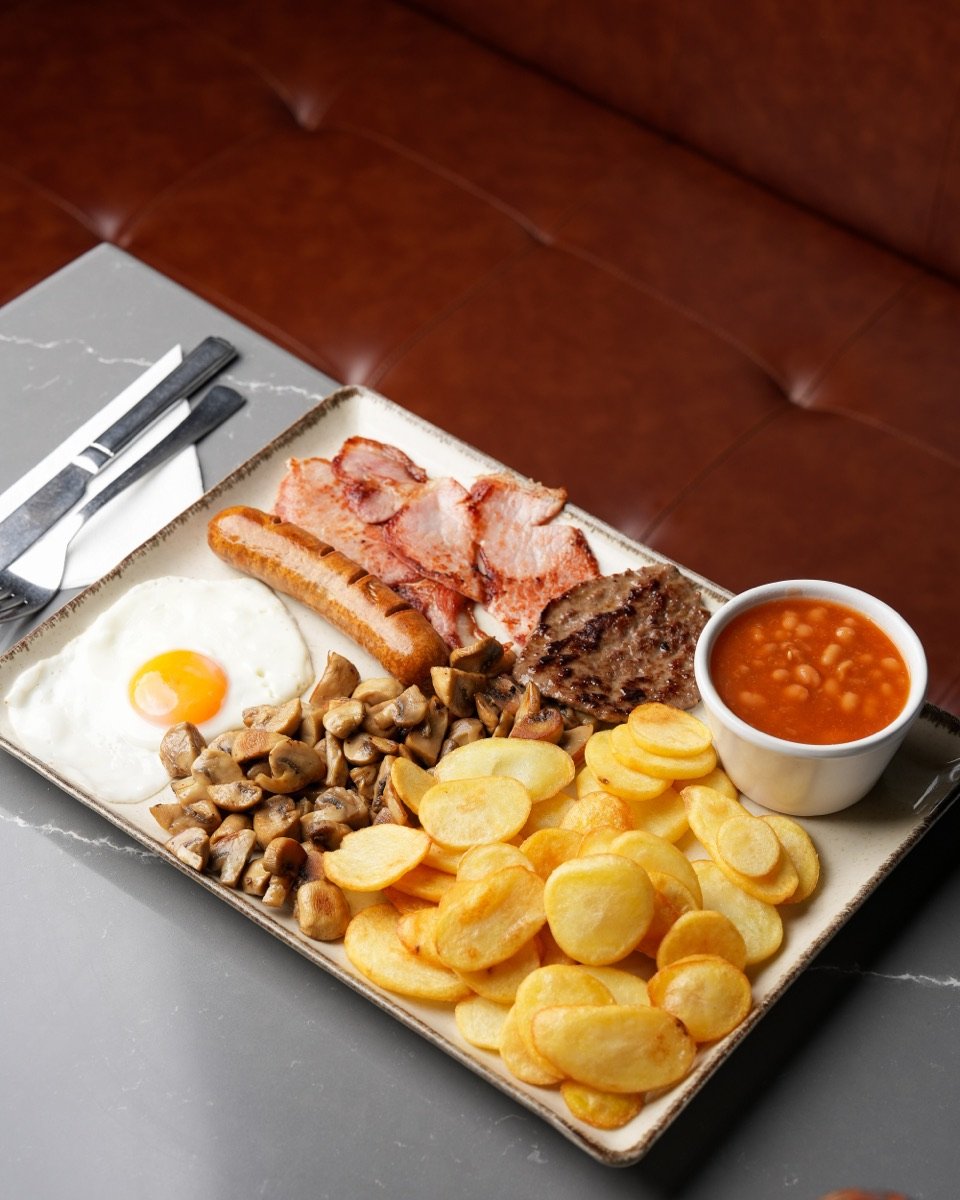 The Big Canons breakfast with sausage, bacon, burger, sauté potatoes, mushrooms and beans at Canons Cafe, Canons Park